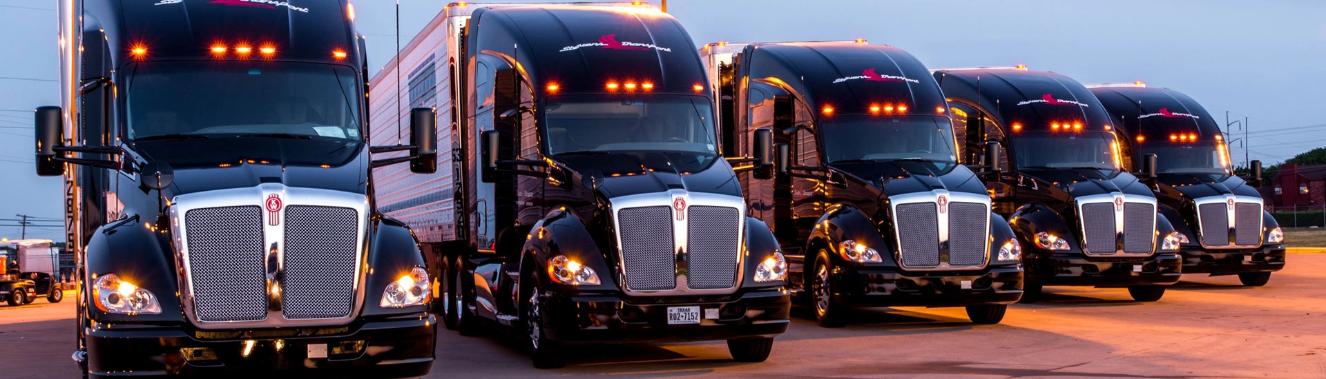 rows of black trucks monitored by fleet management software